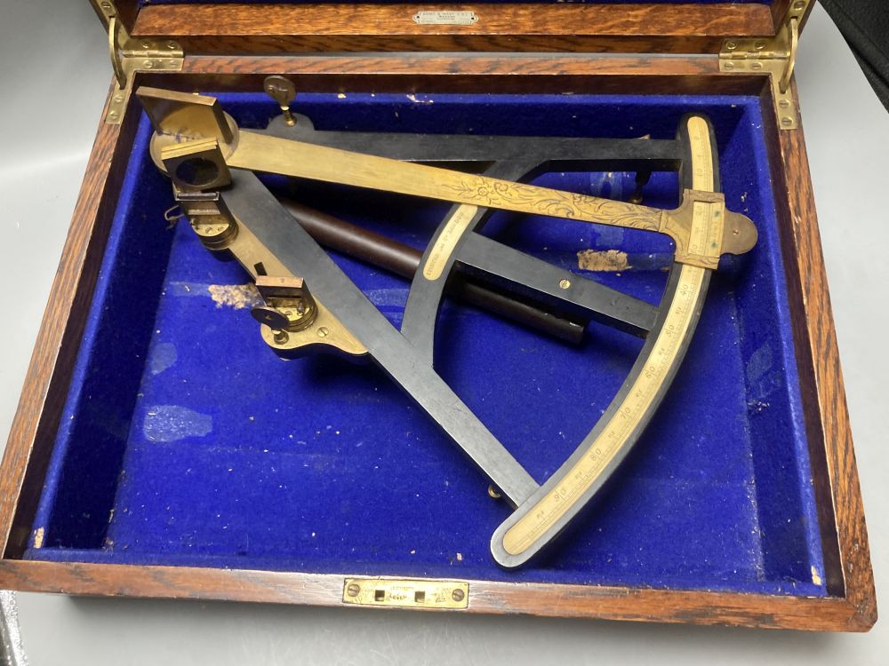 A large 19th century ebony and brass octant, scale 0-95 degrees, by Spencer & Co London, ivory scale, associated box